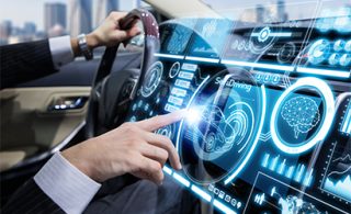 man-in-a-car-pressing-a-button-digitalization_s